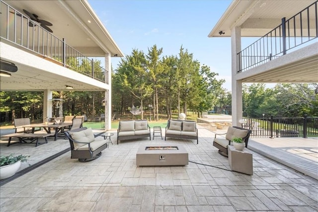 5645 Legler St, Shawnee, KS 66217 - patio / terrace with an outdoor living space with a fire pit and a patio area