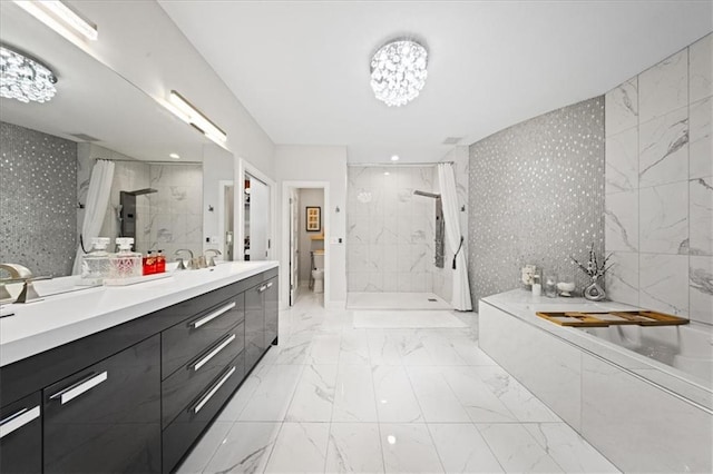 5645 Legler St, Shawnee, KS 66217 - full bathroom with vanity, a garden tub, a tile shower, marble finish flooring, and wallpapered walls