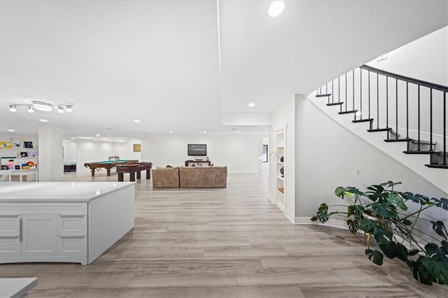 5645 Legler St, Shawnee, KS 66217 - hallway featuring stairs, recessed lighting, and light wood-style floors
