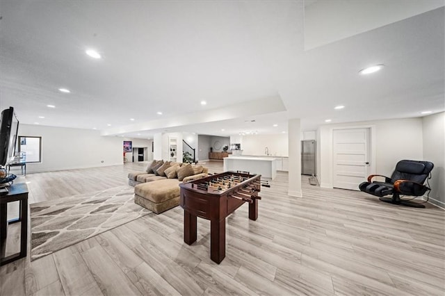 5645 Legler St, Shawnee, KS 66217 - rec room with light wood-style floors and recessed lighting