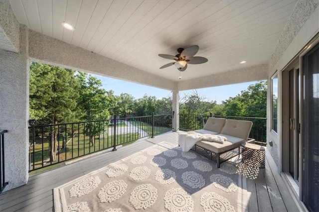 5645 Legler St, Shawnee, KS 66217 - wooden terrace with ceiling fan and view of wooded area