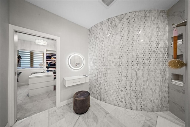 5645 Legler St, Shawnee, KS 66217 - bathroom with marble finish floors, a tile shower, and a walk in closet