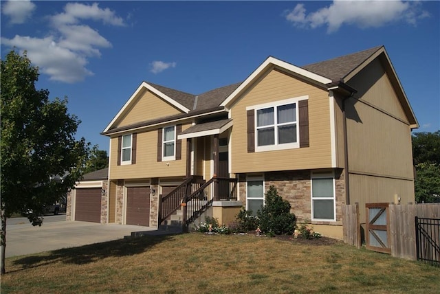 706 Terry Dr, Pleasant Hill, MO 64080 - bi-level home featuring driveway, an attached garage, and stone siding
