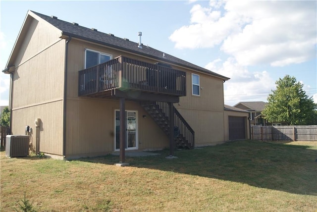 706 Terry Dr, Pleasant Hill, MO 64080 - back of property with stairs, cooling unit, a wooden deck, and a garage