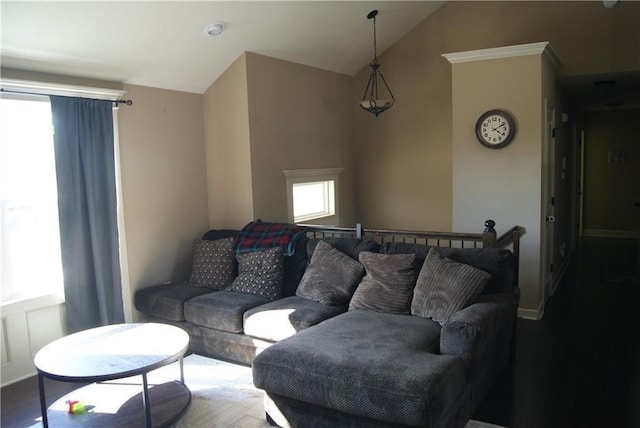 706 Terry Dr, Pleasant Hill, MO 64080 - living room featuring vaulted ceiling, wood finished floors, and baseboards