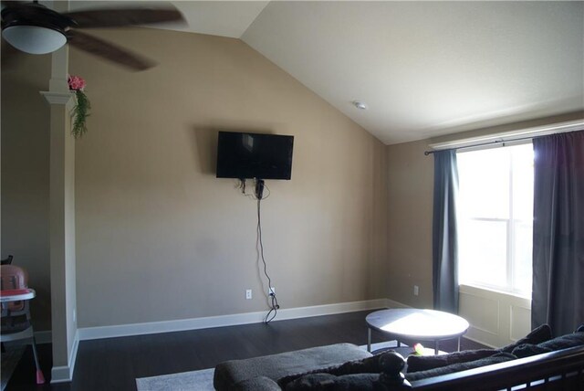 706 Terry Dr, Pleasant Hill, MO 64080 - living room featuring vaulted ceiling, dark wood-style flooring, ceiling fan, and baseboards