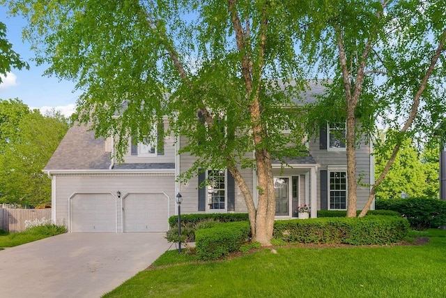 view of front of home with driveway and an attached garage
