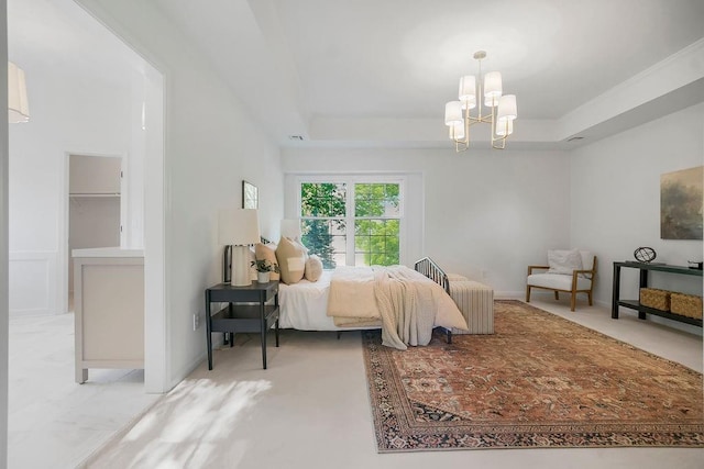 bedroom with a chandelier, carpet, and a tray ceiling