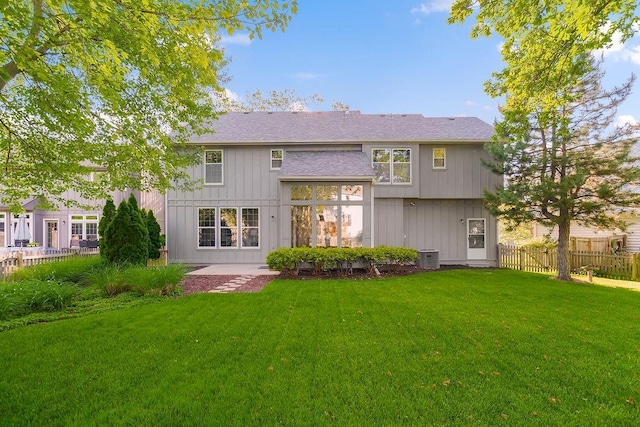 back of house featuring central AC