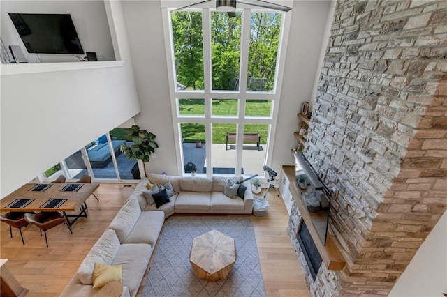 living area with wood finished floors and a fireplace