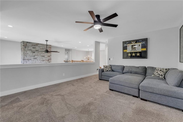 carpeted living room with ceiling fan, recessed lighting, a chandelier, and baseboards