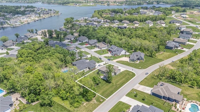 view of property location with nearby suburban area and a large body of water