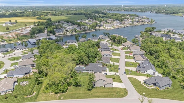 aerial view of property's location featuring nearby suburban area and a nearby body of water