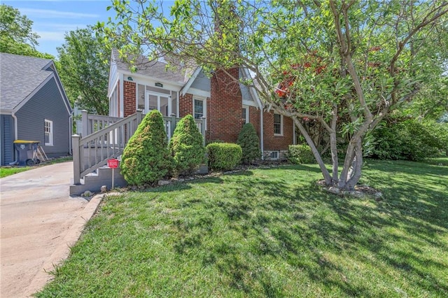 7126 Charlotte St, Kansas City, MO 64131 - view of front of property with brick siding and a front lawn