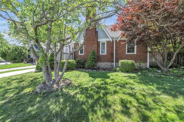 7126 Charlotte St, Kansas City, MO 64131 - view of home's exterior with brick siding and roof with shingles