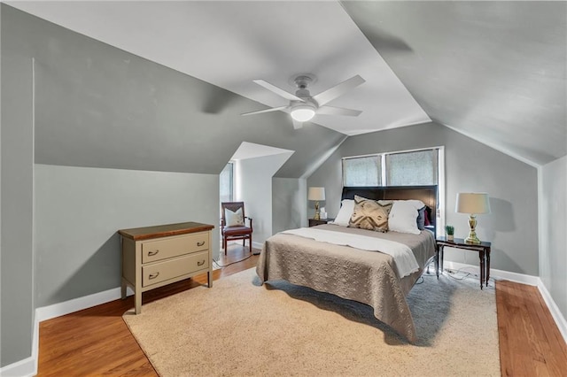 7126 Charlotte St, Kansas City, MO 64131 - bedroom featuring wood finished floors, a ceiling fan, baseboards, and lofted ceiling