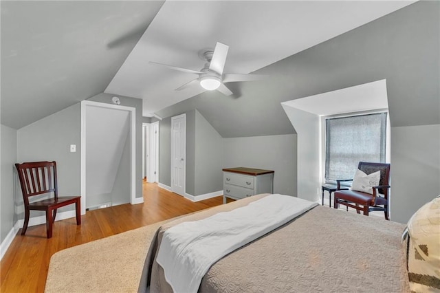 7126 Charlotte St, Kansas City, MO 64131 - bedroom with wood finished floors, lofted ceiling, baseboards, and a ceiling fan