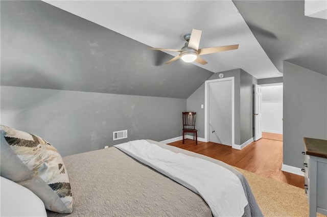 7126 Charlotte St, Kansas City, MO 64131 - bedroom with vaulted ceiling, wood finished floors, baseboards, and a ceiling fan