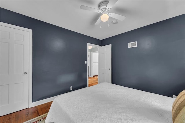 7126 Charlotte St, Kansas City, MO 64131 - bedroom with wood finished floors, baseboards, and a ceiling fan