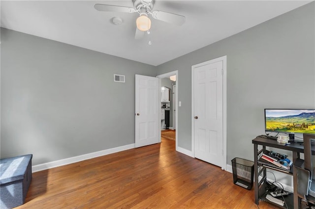 7126 Charlotte St, Kansas City, MO 64131 - office with ceiling fan, wood finished floors, and baseboards