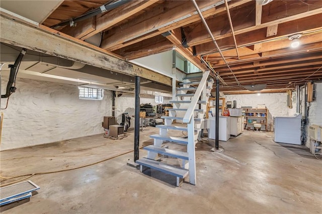 7126 Charlotte St, Kansas City, MO 64131 - below grade area featuring washer / clothes dryer and stairway