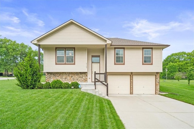 4700 E 136th Ct, Grandview, MO 64030 - split foyer home with stone siding, an attached garage, a front yard, and concrete driveway
