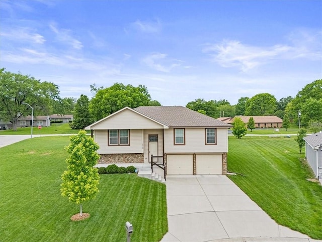4700 E 136th Ct, Grandview, MO 64030 - raised ranch with a garage, stone siding, concrete driveway, and a front lawn
