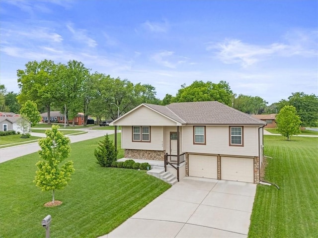 4700 E 136th Ct, Grandview, MO 64030 - split foyer home with an attached garage, driveway, stone siding, and a front lawn