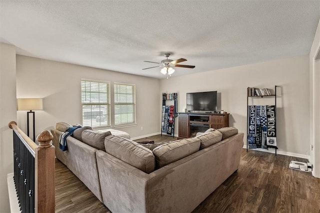 4700 E 136th Ct, Grandview, MO 64030 - living room with ceiling fan, dark wood-type flooring, a textured ceiling, and baseboards