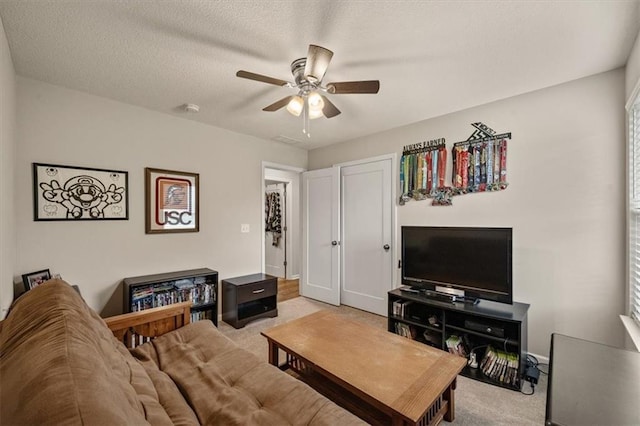 4700 E 136th Ct, Grandview, MO 64030 - living room featuring light colored carpet, a ceiling fan, and baseboards