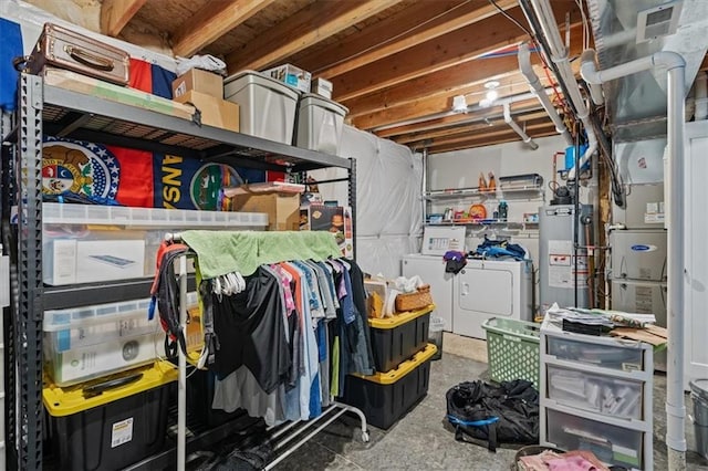 4700 E 136th Ct, Grandview, MO 64030 - storage room with washer and clothes dryer and water heater
