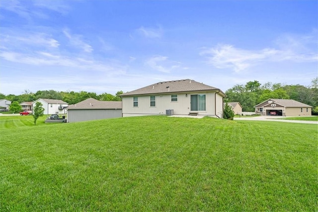 4700 E 136th Ct, Grandview, MO 64030 - rear view of property featuring a yard