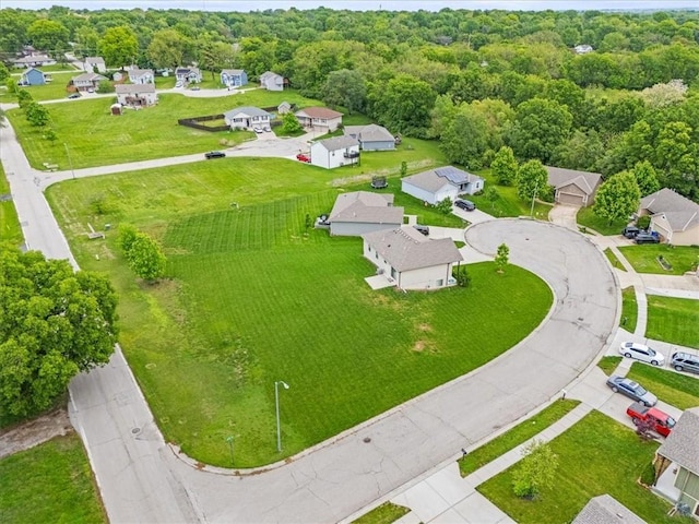 4700 E 136th Ct, Grandview, MO 64030 - aerial perspective of suburban area with a heavily wooded area