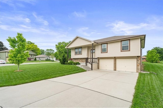 4700 E 136th Ct, Grandview, MO 64030 - raised ranch with a garage, driveway, a front yard, and stone siding