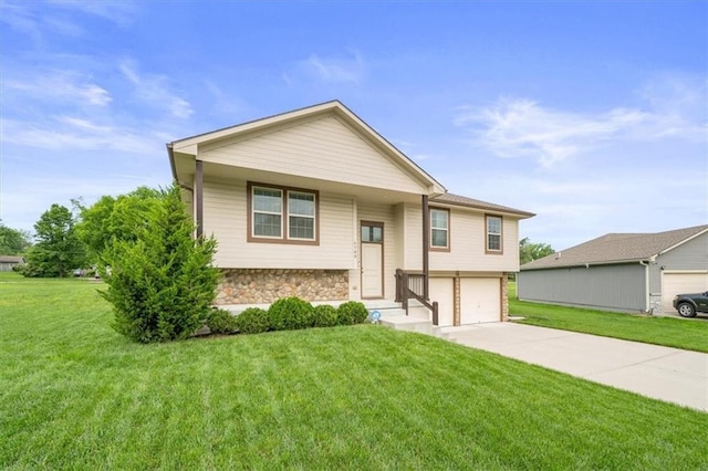 4700 E 136th Ct, Grandview, MO 64030 - raised ranch with a garage, stone siding, a front lawn, and concrete driveway