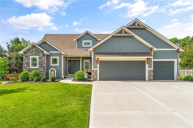 craftsman inspired home featuring an attached garage, stucco siding, and stone siding