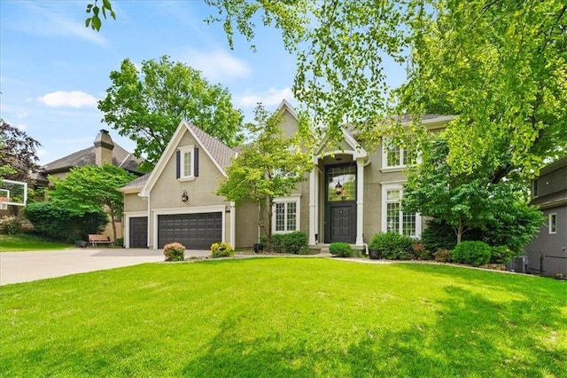 5817 W 147th Pl, Overland Park, KS 66223 - traditional home with a front yard, stucco siding, concrete driveway, and cooling unit