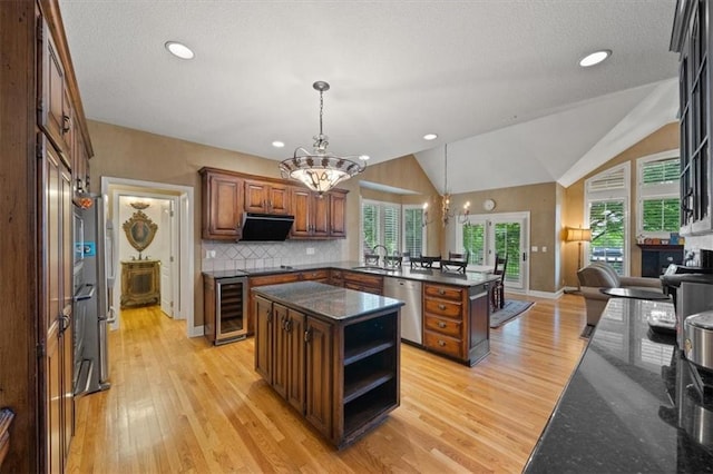 5817 W 147th Pl, Overland Park, KS 66223 - kitchen featuring beverage cooler, stainless steel dishwasher, a chandelier, a peninsula, and light wood-style flooring