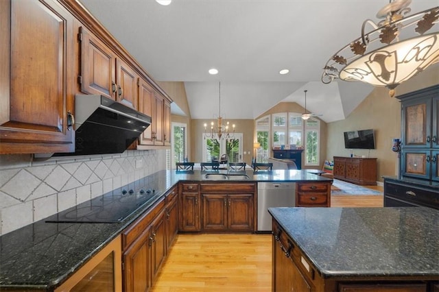 5817 W 147th Pl, Overland Park, KS 66223 - kitchen with stainless steel dishwasher, black electric cooktop, light wood-style flooring, a chandelier, and a sink