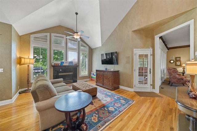 5817 W 147th Pl, Overland Park, KS 66223 - living area with ceiling fan, wood finished floors, baseboards, a fireplace, and high vaulted ceiling
