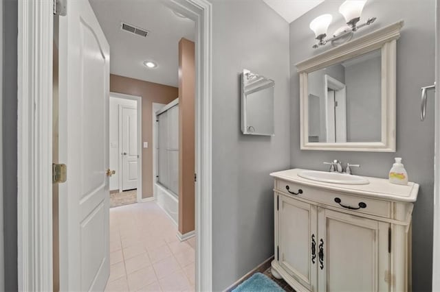 5817 W 147th Pl, Overland Park, KS 66223 - bathroom with an enclosed shower, tile patterned flooring, vanity, and baseboards