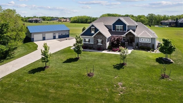 30307 Woodland Dr, Pleasant Hill, MO 64080 - craftsman-style home with a garage, an outdoor structure, driveway, and a front yard