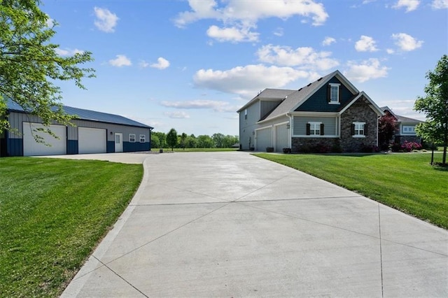 30307 Woodland Dr, Pleasant Hill, MO 64080 - view of front facade with concrete driveway, a front yard, and a garage
