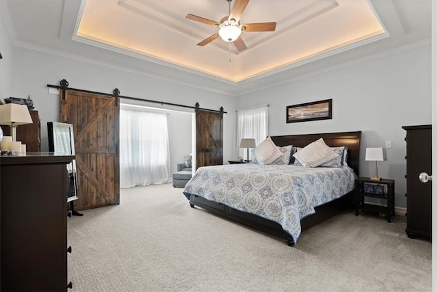30307 Woodland Dr, Pleasant Hill, MO 64080 - carpeted bedroom featuring a raised ceiling, a barn door, a ceiling fan, and crown molding