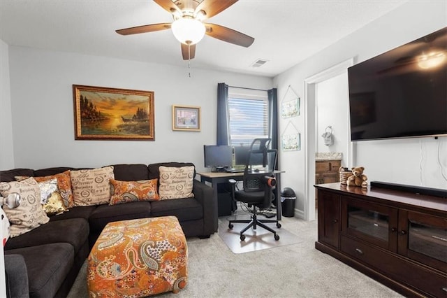 30307 Woodland Dr, Pleasant Hill, MO 64080 - living room featuring light colored carpet, a desk, and a ceiling fan