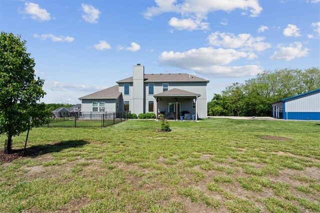 30307 Woodland Dr, Pleasant Hill, MO 64080 - rear view of property with a chimney