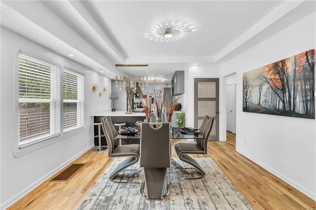 dining area featuring wood finished floors, baseboards, and recessed lighting