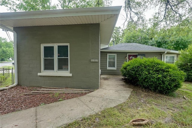 10101 E 18th St, Independence, MO 64052 - property entrance featuring concrete block siding