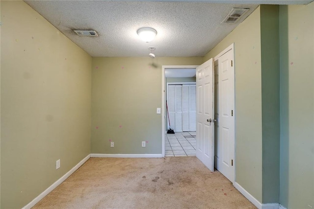 10101 E 18th St, Independence, MO 64052 - empty room with carpet floors, baseboards, and a textured ceiling