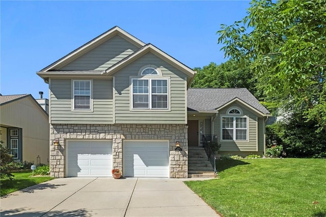 12434 England St, Overland Park, KS 66213 - split level home featuring driveway, a front lawn, a garage, and stone siding